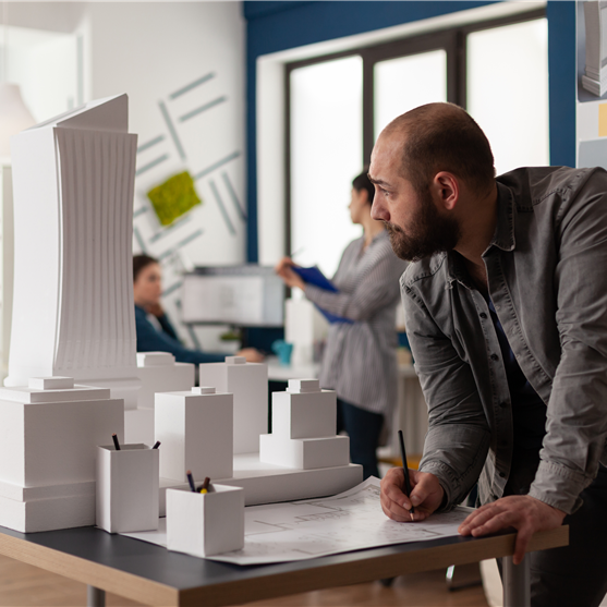 Architects reviewing a building model
